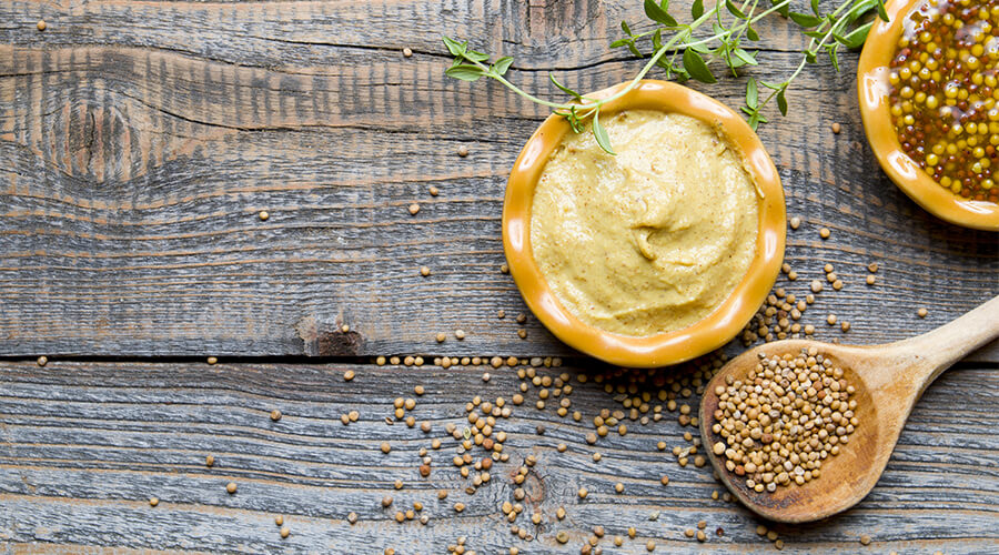 mustard on wooden table