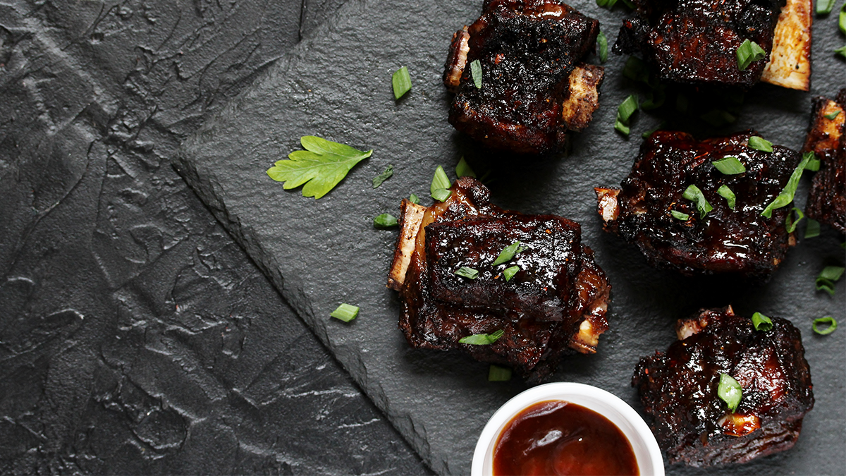 Short ribs with with bbq sauce and garnish
