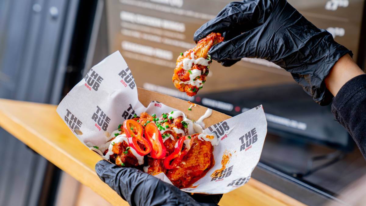 holding chicken wing